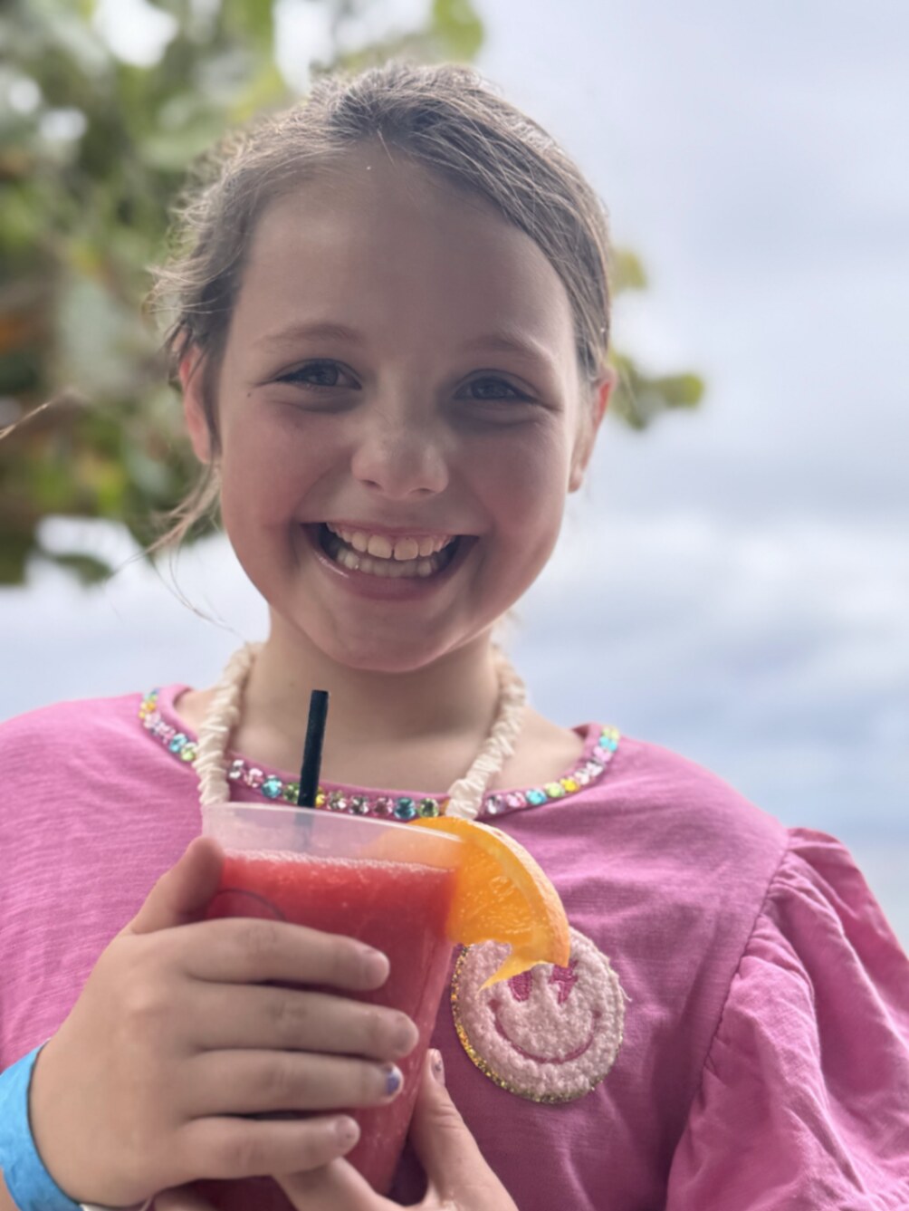 Rosemary smiling with a fresh strawberry smoothie